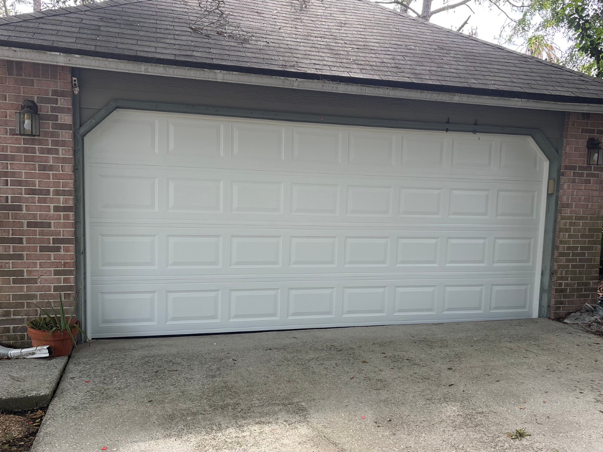 New impact-rated carriage house garage doors installed on a South Florida home