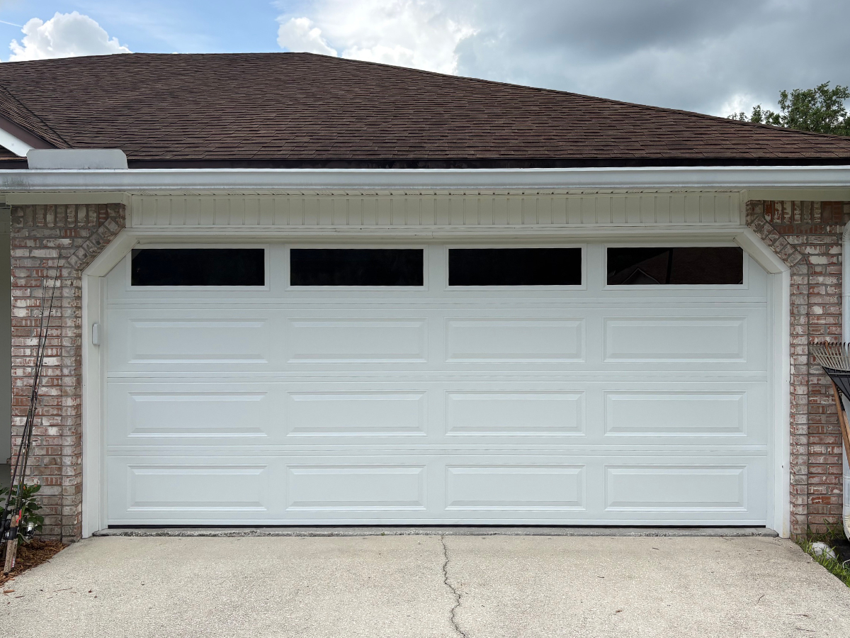 Beachside Garage Doors technician replacing a torsion spring in Palm Beach County